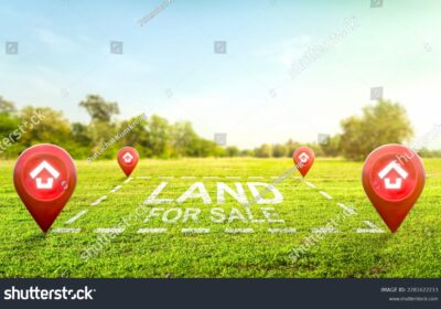 stock-photo-land-plot-management-real-estate-concept-with-a-vacant-land-on-a-green-field-available-for-2281622213